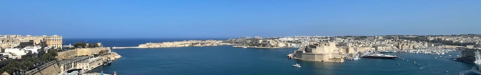 A panorama of the Grand Harbour — Valletta bastions to the left, Fort St Angelo and the Three Cities to the right.