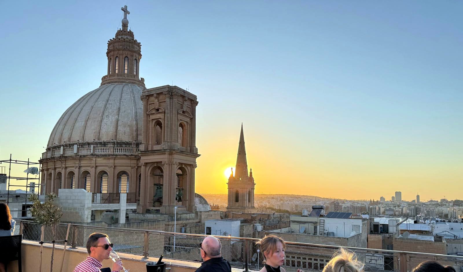 The Valletta skyline with the Carmelite dome and St Paul's Anglican Pro-Cathedral spire above the rooftops.